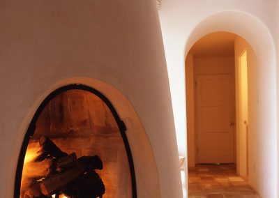 Artists Studio with arched hallway and fireplace