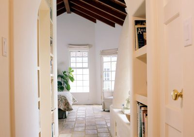 Artists Studio hallways with arched ceiling and stone tile floors